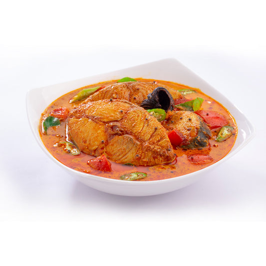 Kerala-style fish curry served in a white bowl, prepared using Mantra Herbs Fish Masala – homemade natural spice blend for authentic flavour.